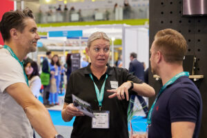 MCS Compliance Analyst, Sarah Lees, talking with contractors on stand at InstallerSHOW 2023.