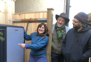 Lucy-Galvin-shows-visitors air source heat pump.